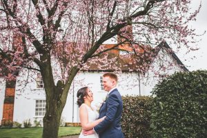 bride and groom spring wedding blossom tree